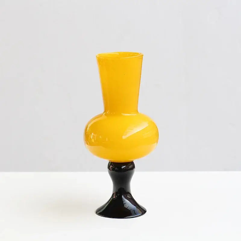 Vibrant yellow vintage glass vase with sleek black base for decorbites geometric vintage living room decor