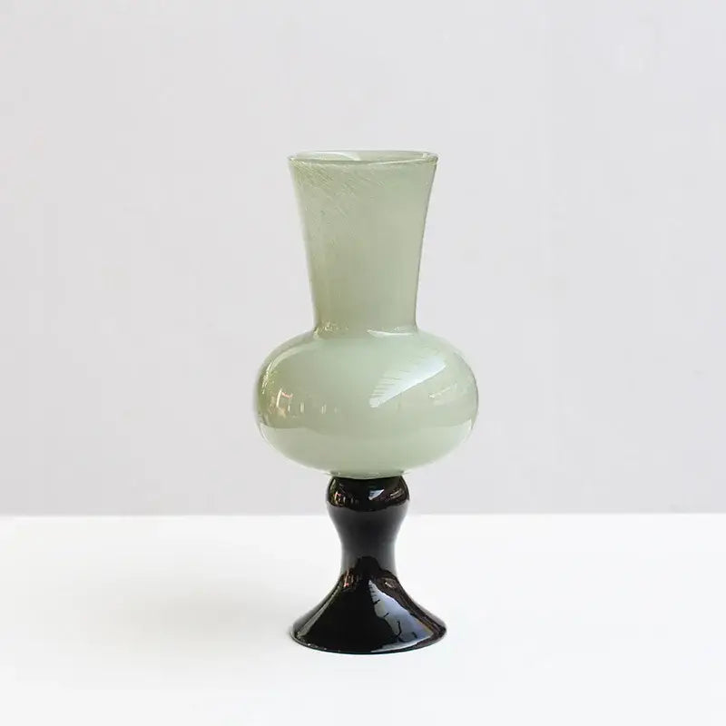 A sleek pale green geometric vintage glass vase with a glossy black pedestal base for decorbites vintage glass vase decor