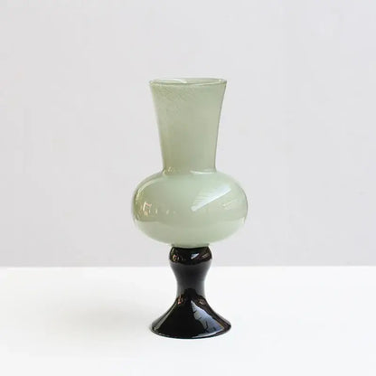 A sleek pale green geometric vintage glass vase with a glossy black pedestal base for decorbites vintage glass vase decor