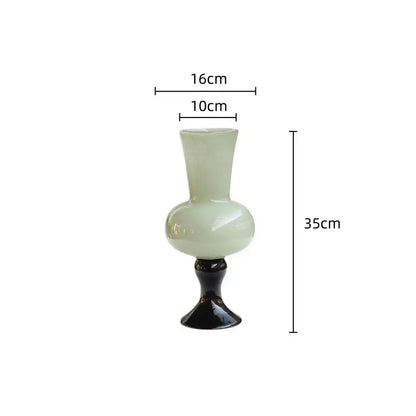 A sleek translucent pale green vintage glass vase with glossy black base for decorbites geometric vintage decor