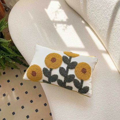 Rectangular white pillow covers with geometric waves tufted cream design featuring mustard-yellow flowers and dark green leaves