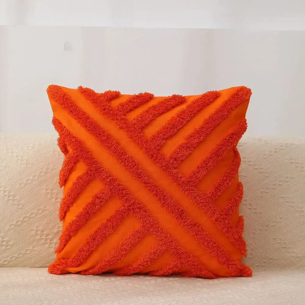 Vibrant orange pillow cover with textured fringed diagonal stripes from decorbites geometric waves tufted collection