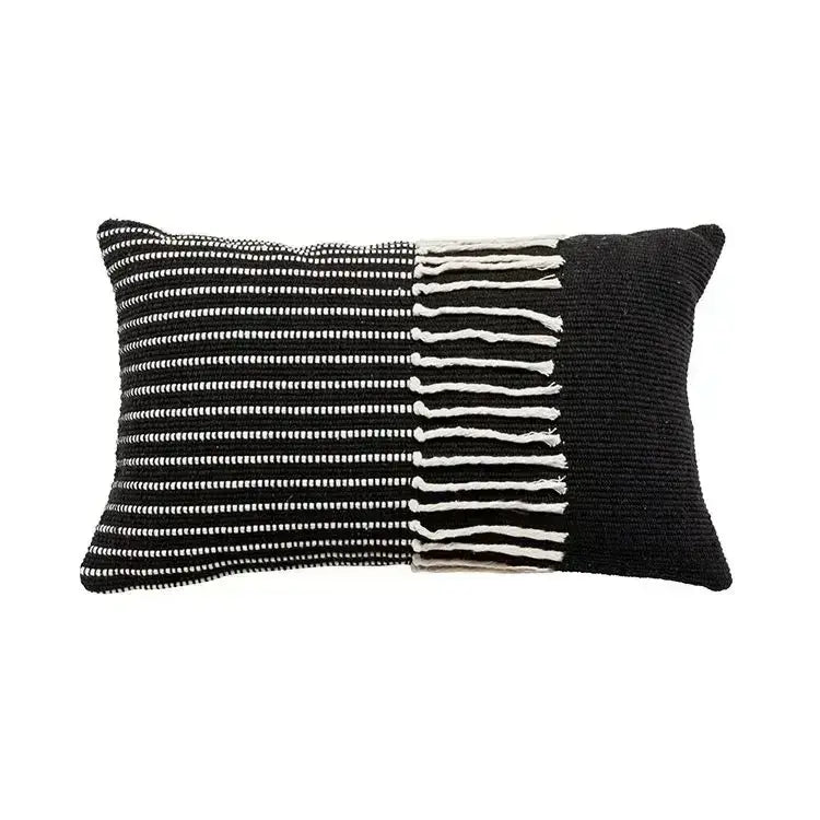 Black and white woven pillow cover with textured knit geometric waves tufted pattern and fringe detailing edge decorbites