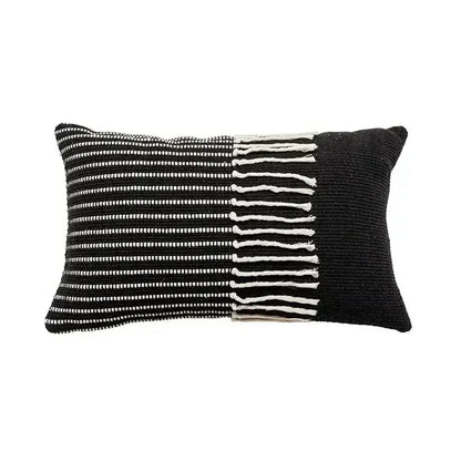 Black and white woven pillow cover with textured knit geometric waves tufted pattern and fringe detailing edge decorbites