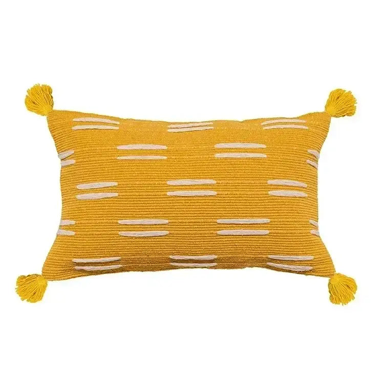 A vibrant yellow geometric waves tufted pillow cover with white embroidered stripes and tassels for bedroom decorbites decor