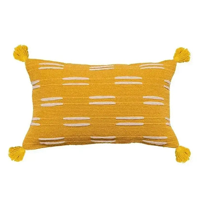 A vibrant yellow geometric waves tufted pillow cover with white embroidered stripes and tassels for bedroom decorbites decor