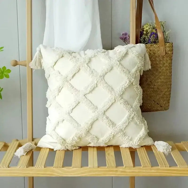 Cream-colored geometric waves tufted pillow cover with textured diamond pattern and fringed tassels for decorbites decor