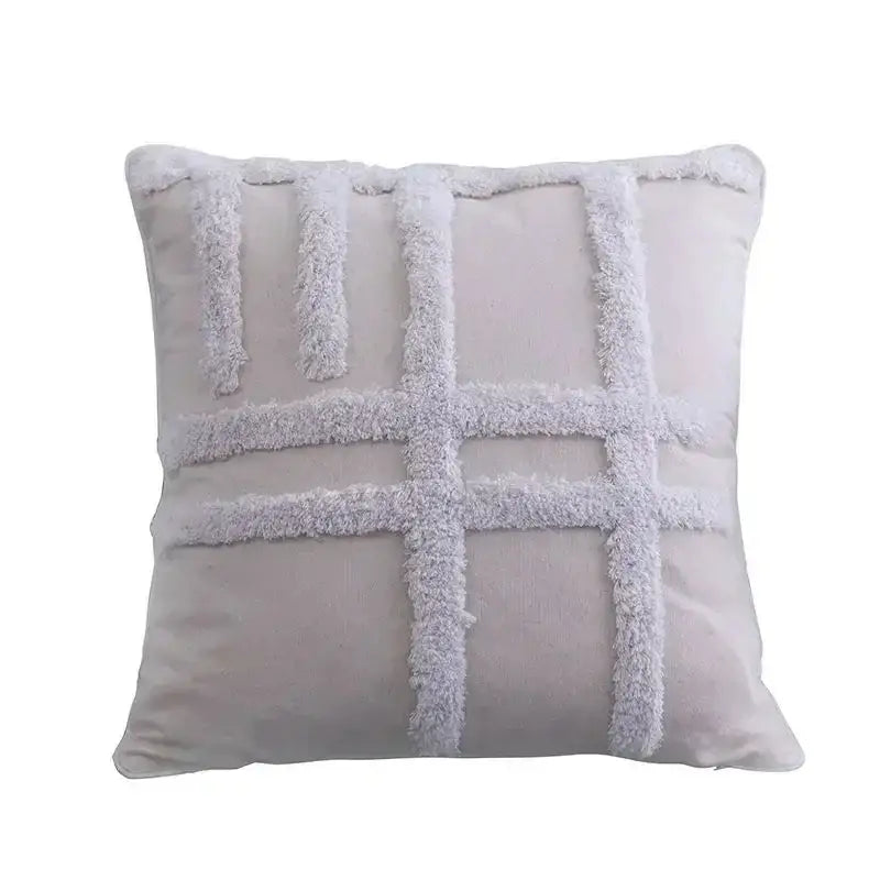 A soft light gray geometric waves tufted pillow cover with textured fringe made of fluffy tassel yarn for bedroom decorbites