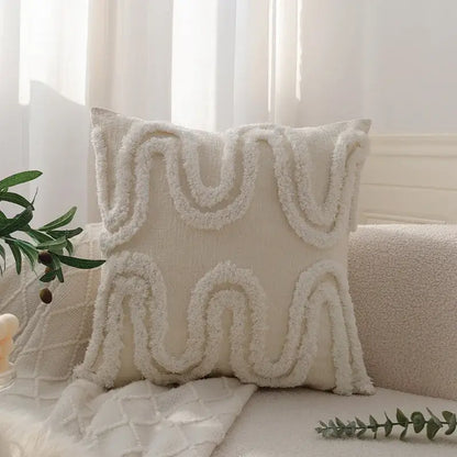 Cream-colored pillow cover with geometric waves tufted pattern and textured fringe in soft plush fabric for decorbites