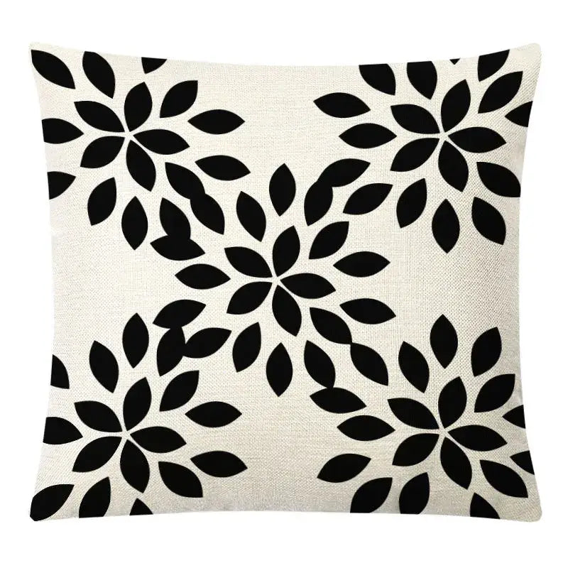 Beige linen throw pillow with bold black floral pattern complementing decorbites geometric yellow linen pillow cover set