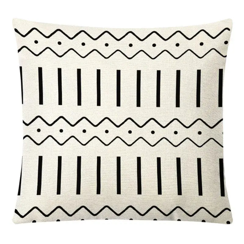 Cream-colored linen throw pillow cover with bold black geometric patterns for decorbites geometric yellow autumnal decor