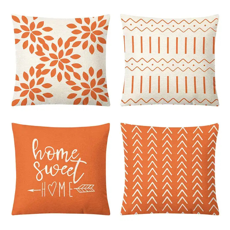 Set of four orange and cream geometric yellow linen pillow covers with floral and script designs for living room decorbites decor