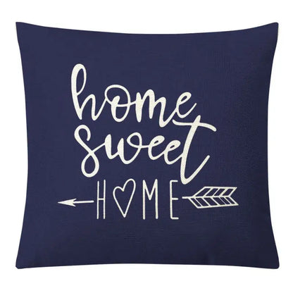 Navy blue pillow cover with white home sweet home text and arrows complements decorbites geometric yellow linen set