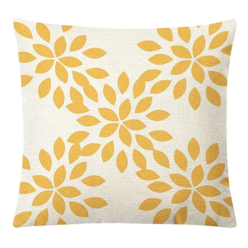 A square beige linen pillow cover with mustard-yellow stylized flowers for decorbites geometric yellow linen decor