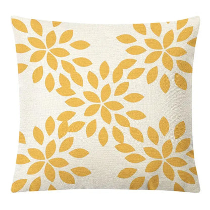 A square beige linen pillow cover with mustard-yellow stylized flowers for decorbites geometric yellow linen decor
