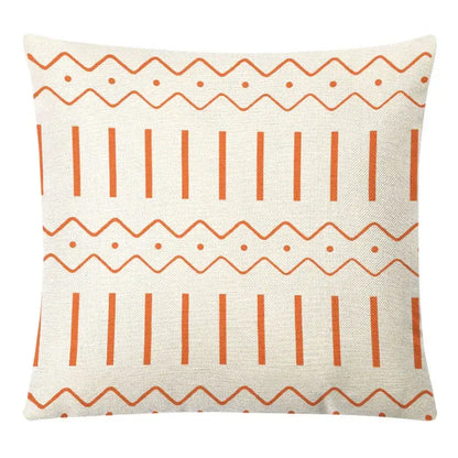 Cream-colored pillow cover with orange geometric patterns in decorbites geometric yellow linen set for autumnal decor