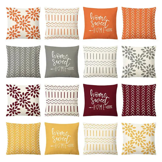 Set of twelve geometric yellow linen pillow covers in autumnal tones with floral patterns and home sweet home decorbites design
