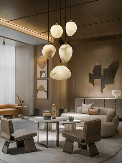 Modern pendant lights with smooth rounded marble led chandelier shades in creamy white and beige by decorbites geometry marble