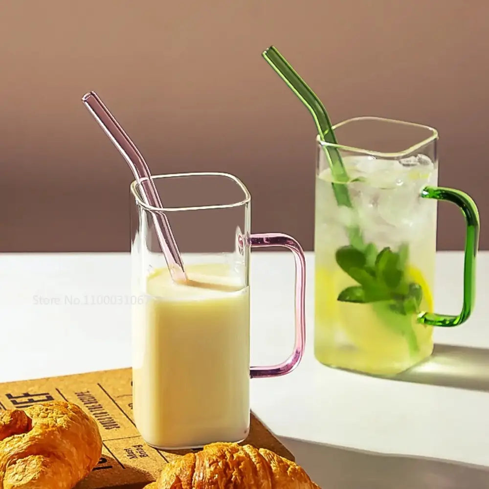 Glass drinking cups with colorful handles and straws featuring milk and lemon-mint drinks by decorbites glass drinking