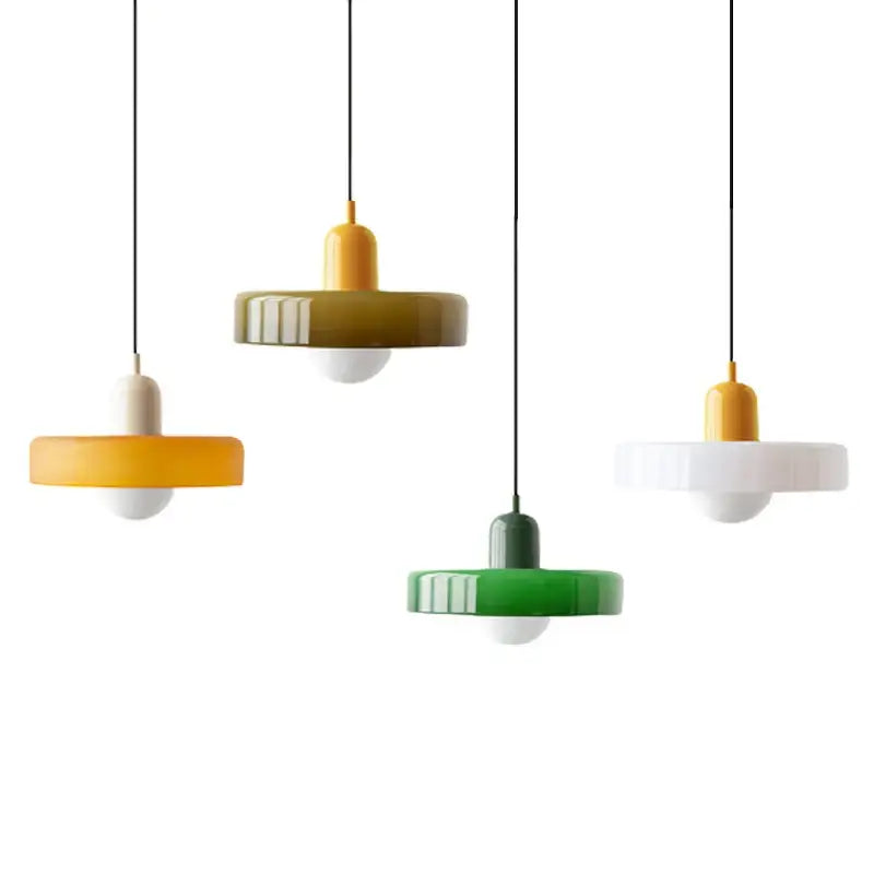 Modern glass pendant lighting with colorful yellow green and white glossy ceramic shades in Bauhaus style