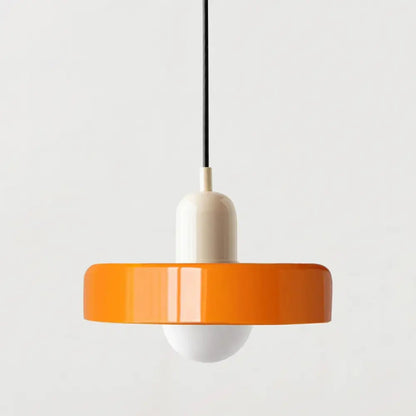 Vibrant orange glass pendant lighting with a glossy finish and cream-colored cylindrical base in Bauhaus style