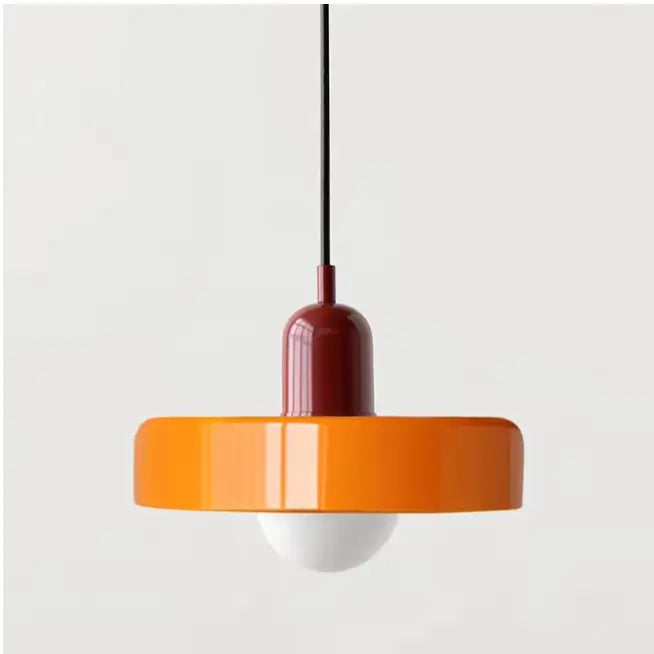 Vibrant orange and deep red glass pendant lighting with a sleek glossy finish in Bauhaus style design