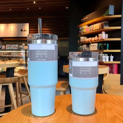 Light blue stainless steel double wall insulated vacuum mugs with silver lids and clear straw holders kitchen use
