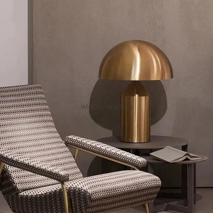 Brass mushroom-shaped table lamp in glossy black and gold metal for decorbites atollo bedroom table lighting