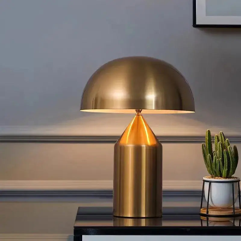Gold-finished mushroom lamp with sleek modern design featured in decorbites atollo black white bedroom table light