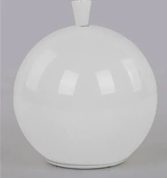 White glossy ceramic vase with rounded body and small rectangular neck displayed alongside a colorful balloon ceiling lamp for kids bedroom