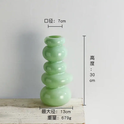 A sleek light green ceramic vase with modern pebble stack floral five rounded segments for living room decor