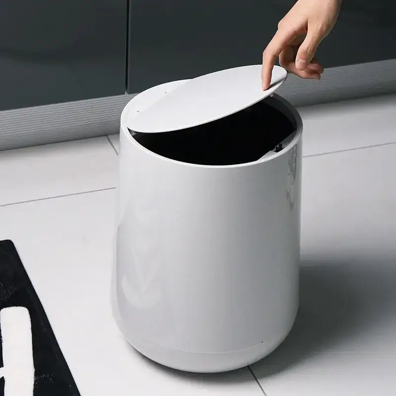 Glossy white cylindrical waste bin with hinged lid for garbage classification in decorbites kitchen bathroom