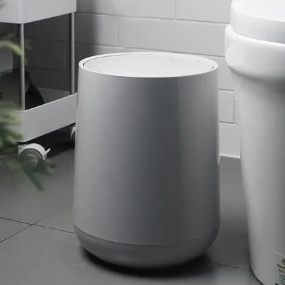 A sleek gray cylindrical waste bin with matte finish for garbage classification in decorbites kitchen bathroom use