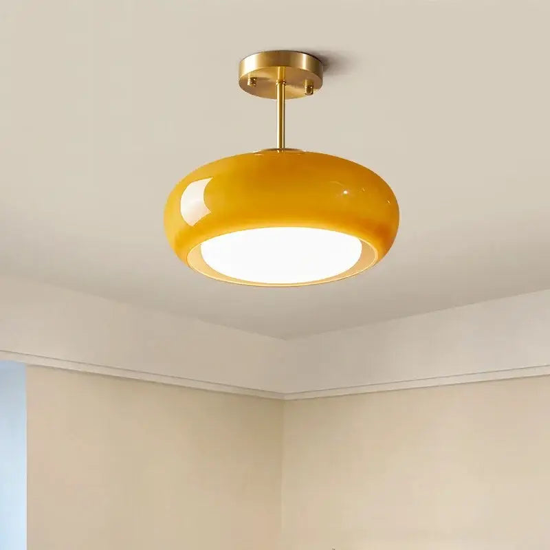 Glossy yellow glass ball led pendant light with brass metal fixture ideal for kitchen or dining room pendant lights