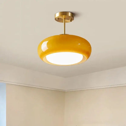 Glossy yellow glass ball led pendant light with brass metal fixture ideal for kitchen or dining room pendant lights