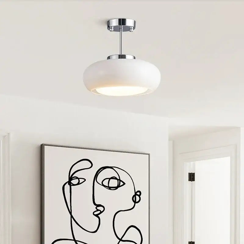 Modern chrome-finished led pendant light with frosted white glass shade ideal for kitchen or dining room lighting