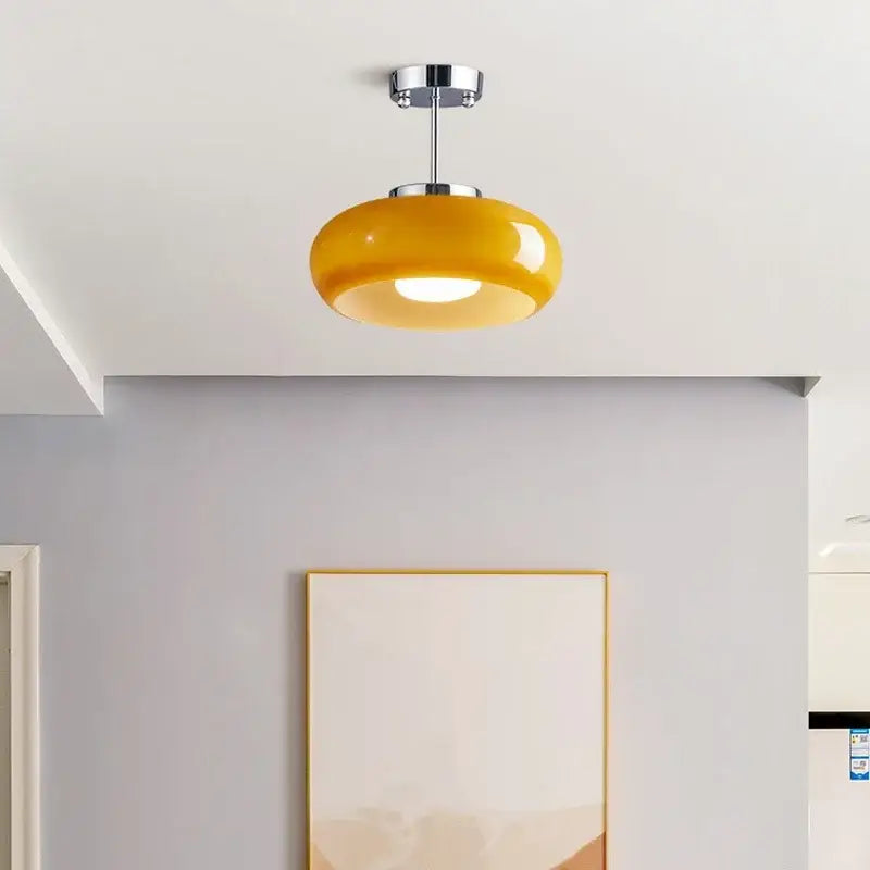 Glossy yellow amber glass led pendant light with sleek chrome fixture ideal for kitchen or dining room pendant lights