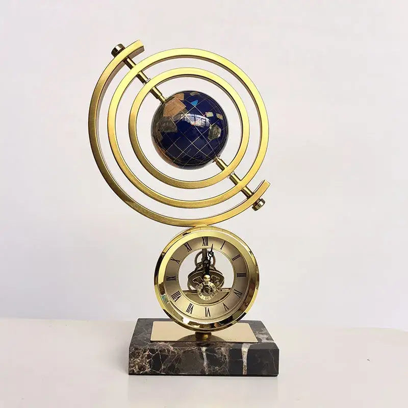 Gold and blue clock globe decoration with blue lapis lazuli earth sphere roman numeral dial on dark marble base