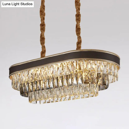 DecorBites 10-light ellipse island pendant with cascading clear and smoky crystal prisms in black bronze frame