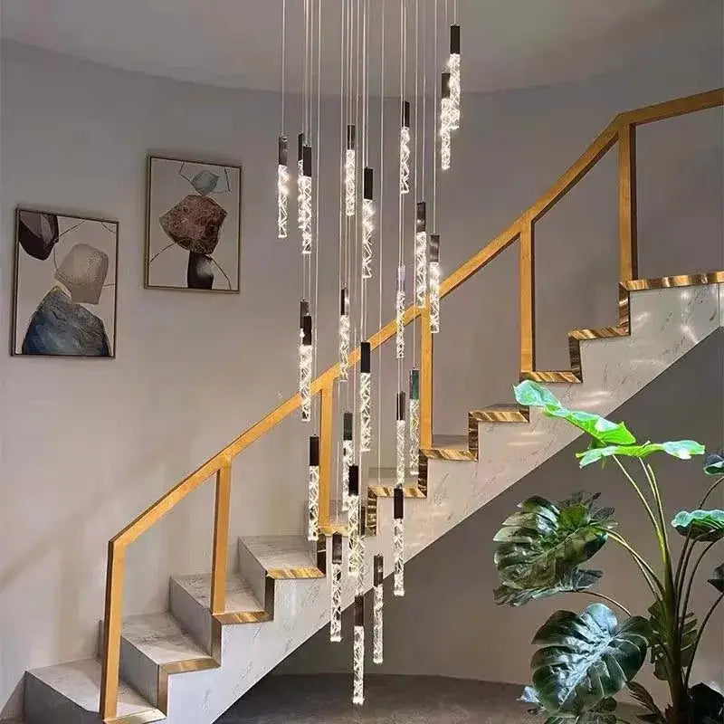 Modern gold and crystal led chandelier with sleek black and clear glass elements for staircase living room decorbites crystal led
