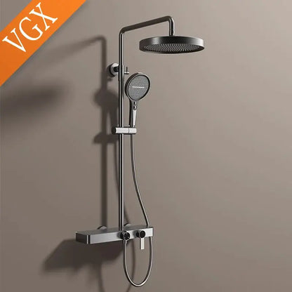 Modern matte black bathroom shower set with round rainhead handheld spray and sleek chrome accents and marble shelf