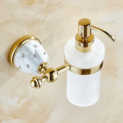 Gold-finished wall-mounted soap dispenser with frosted white glass and crystal-embellished holder in bath hardware set