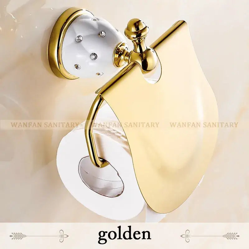 Gold-toned toilet paper holder with white ceramic base and rhinestones from elegant gold and white crystal bath hardware set