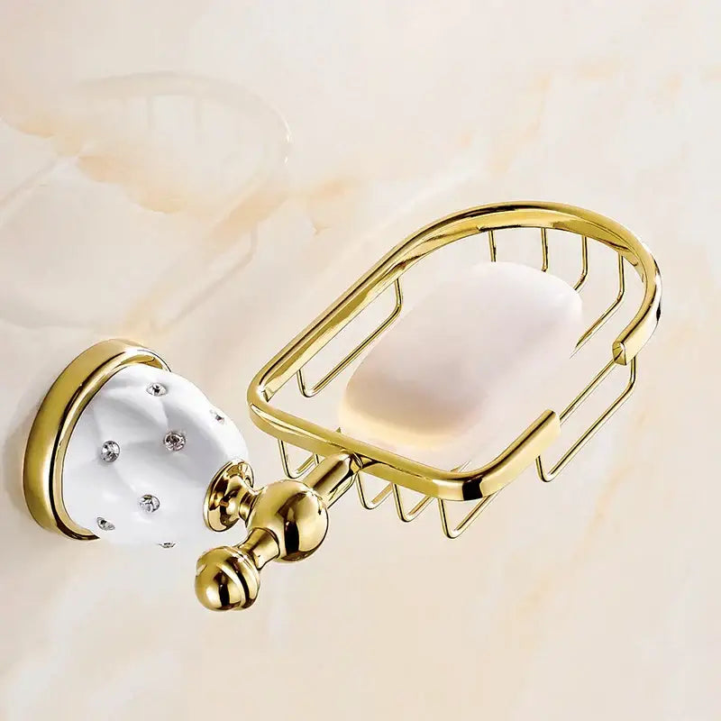 Gold-toned metal soap dish with white ceramic base and clear rhinestones in gold and white crystal bath hardware set