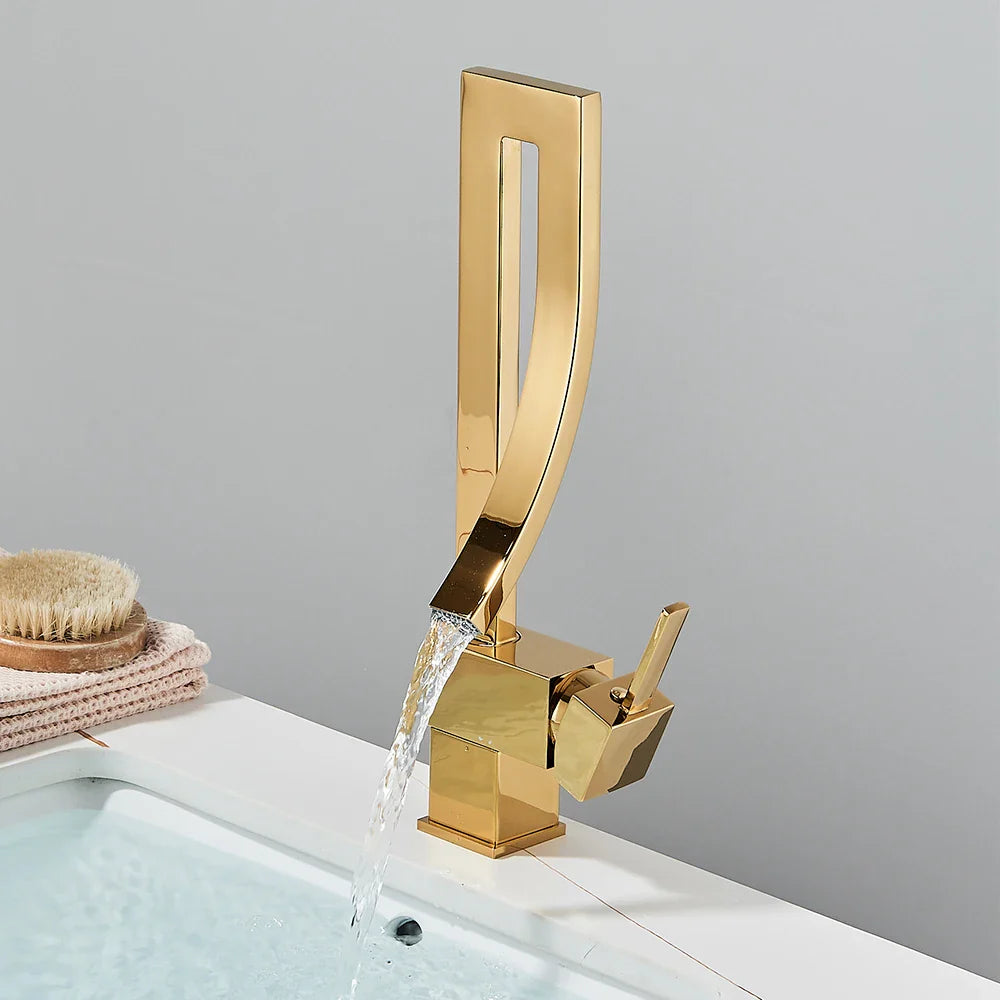 Gold-toned modern single hole deck mounted bathroom basin faucet with sleek angular design and flowing spout chrome black hot cold mixer taps
