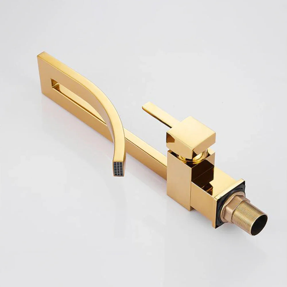 Gold bathroom basin faucet with sleek angular design and curved spout single hole deck mounted hot and cold mixer tap