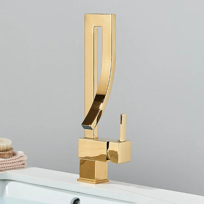 Gold single hole deck mounted bathroom basin faucet with sleek angular design and polished metallic finish