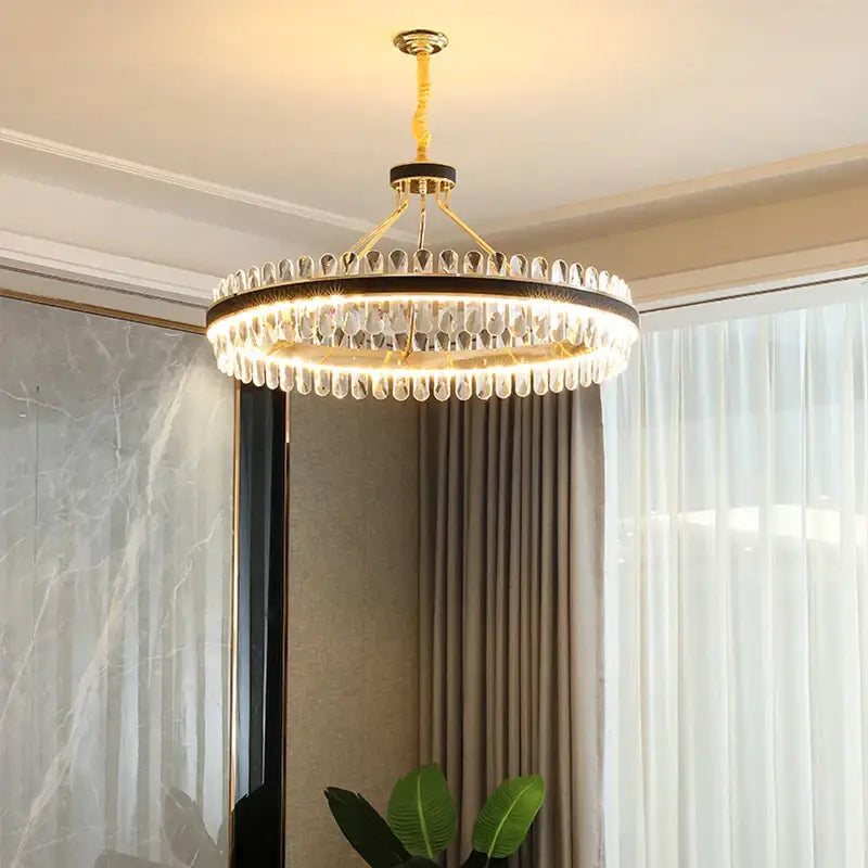 Gold and black crystal oval chandelier with gold metal frame and teardrop crystal droplets for dining room decorbites crystal oval