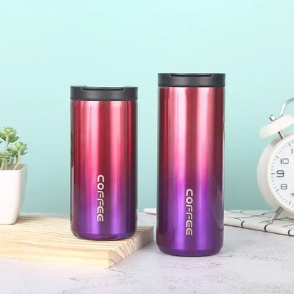 Two decorbites insulated espresso travel mugs with red to purple gradient stainless steel and black lids