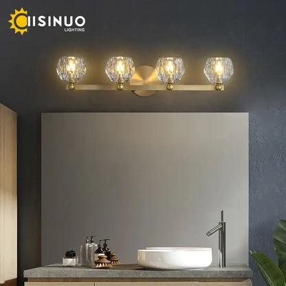 Gold brass vanity light fixture with four crystal glass globe shades ideal for bathroom vanity light fixtures